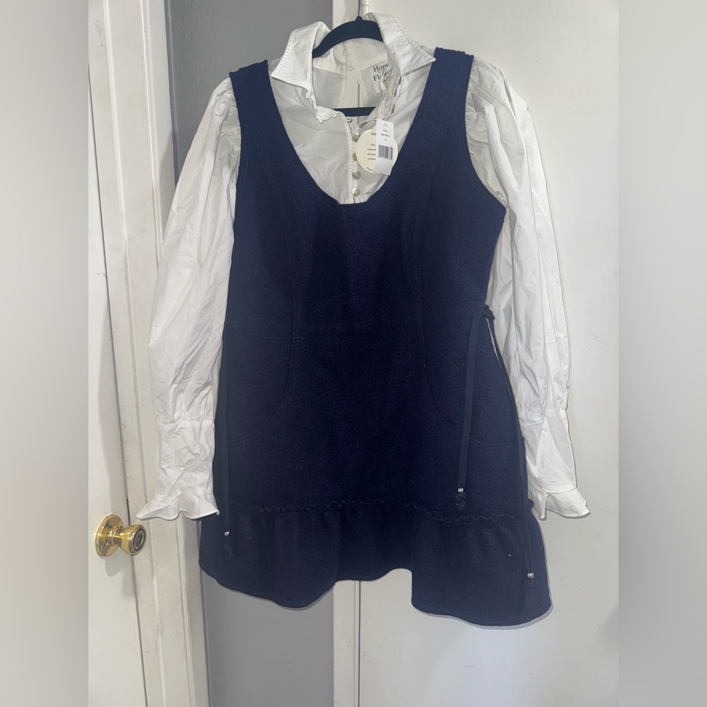 Combo mini dress has an organic cotton undershirt with appliqued wool dress.